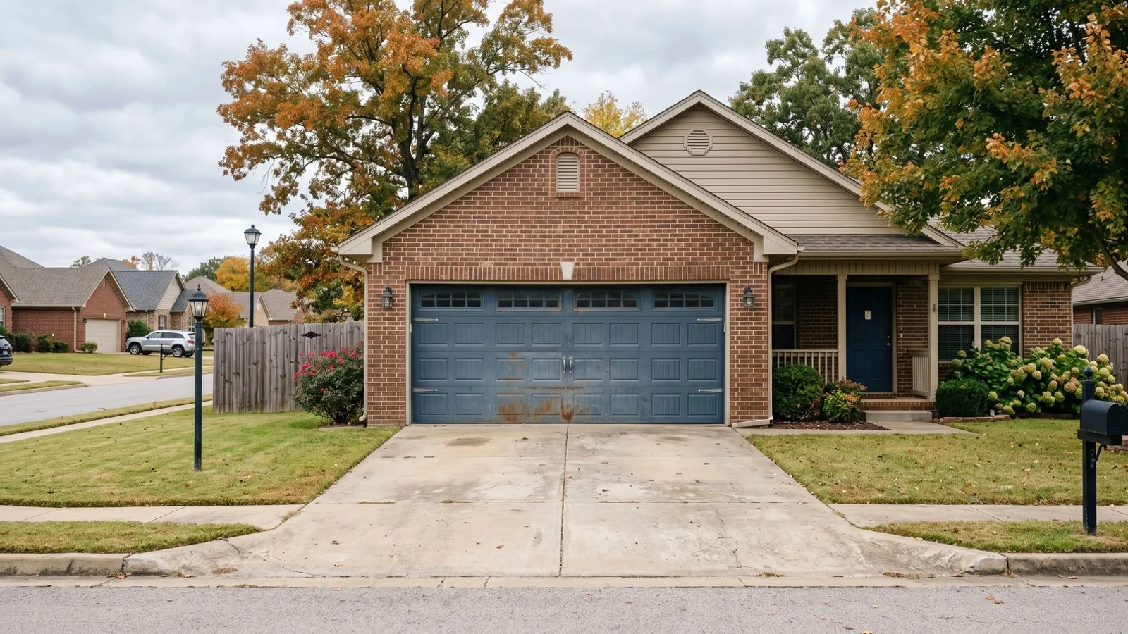 Aged but solid steel garage door on a Northwest Arkansas home